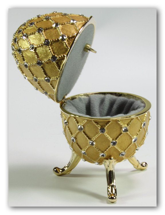 Spieluhren-Schmuck-Ei goldfarben nach Faberge-Art aus emailiertem Metall